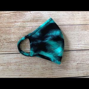 Teal and black geometric print face mask